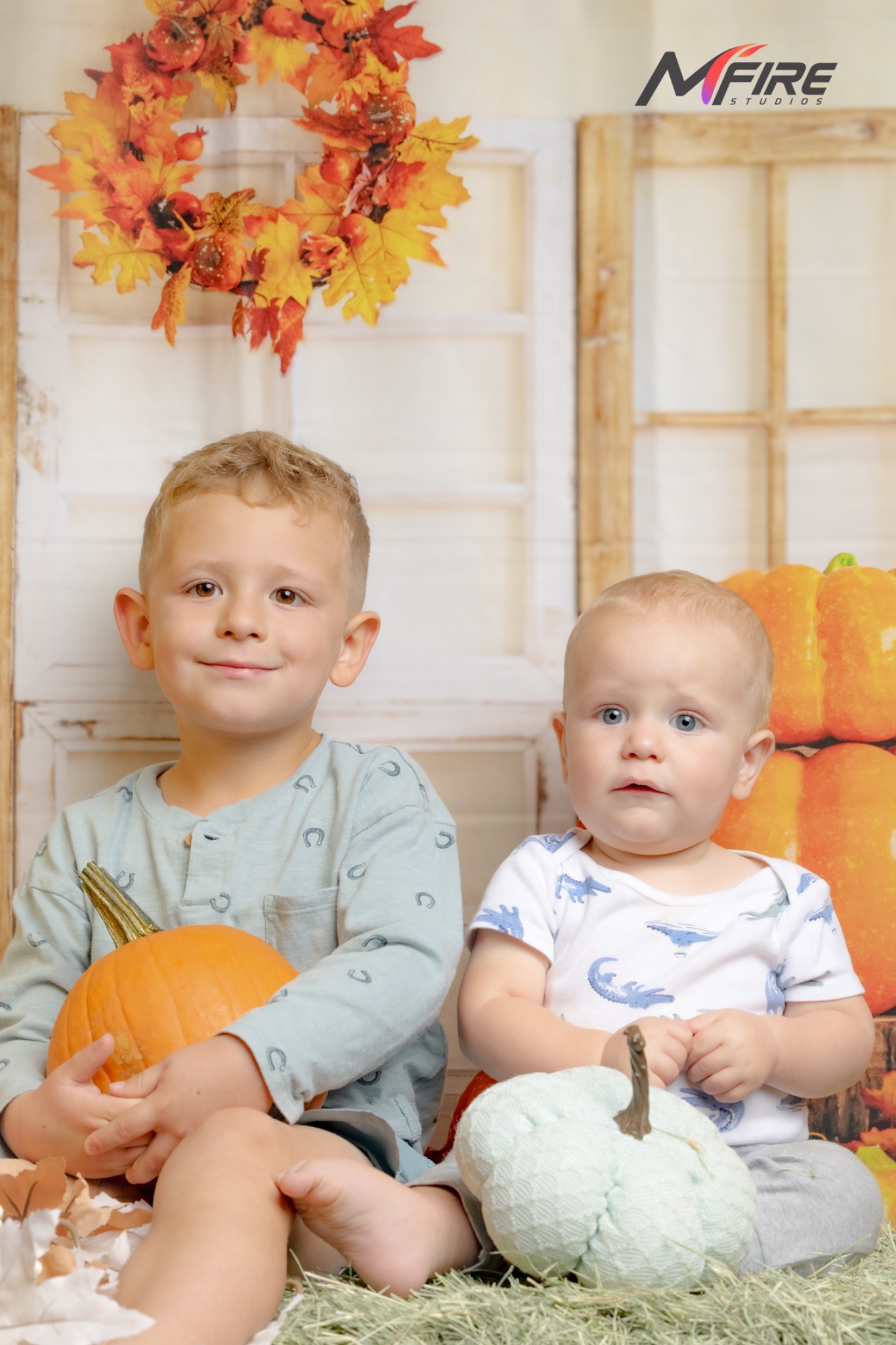 Siblings seated together on the Mfire Studios fall set